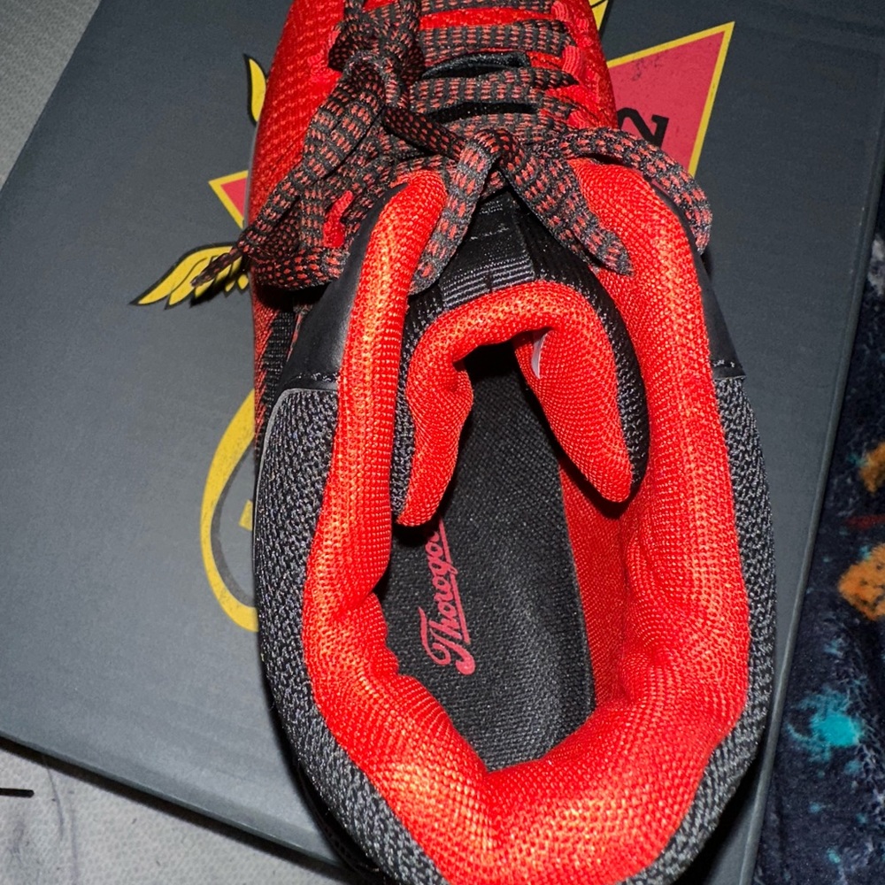 Thorogood black and red men’s 11 1/2 wide work shoes.
